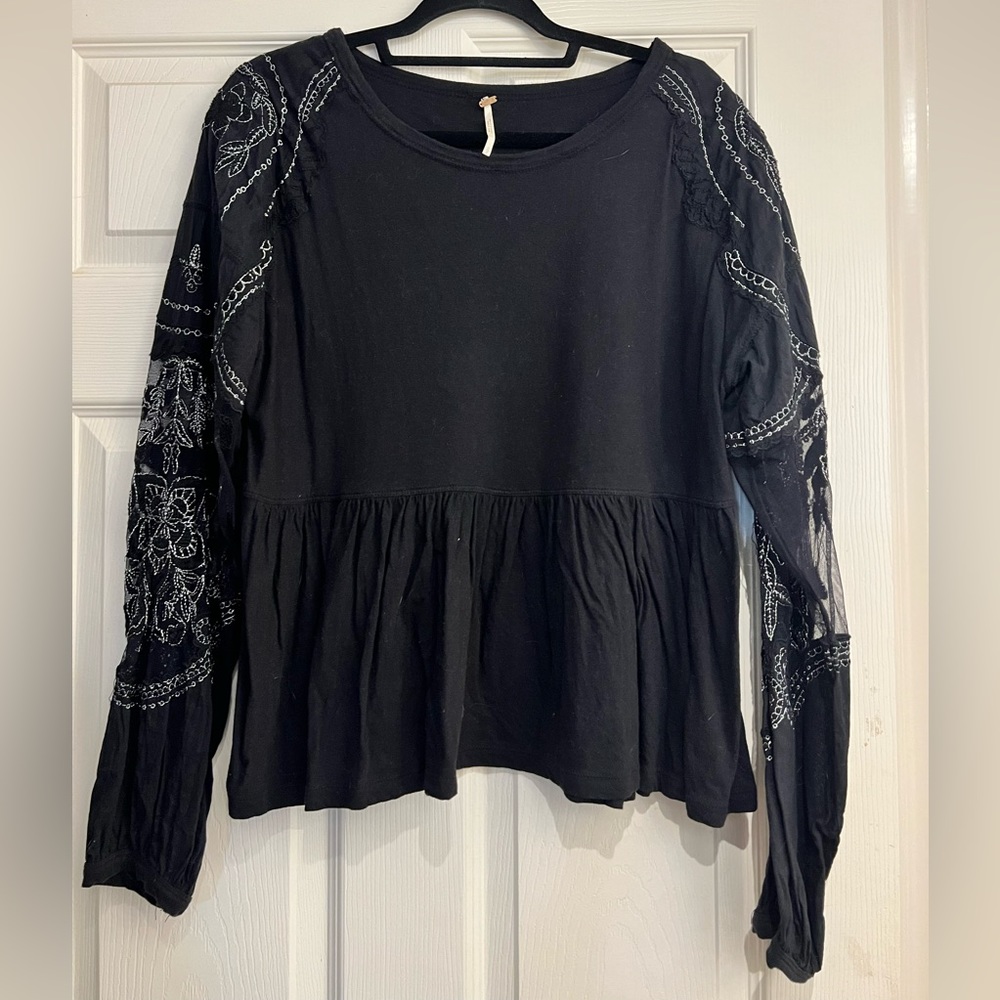Free people black peplum shirt.